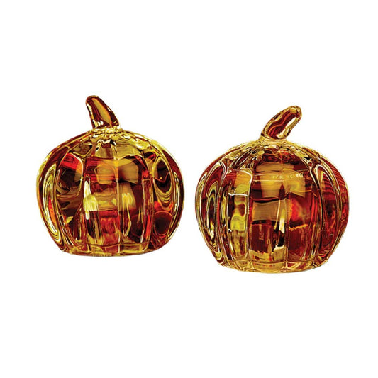 Salt and pepper shaker set made to resemble amber color pumpkins. 