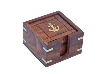 Rosewood coaster set with a gold anchor design that includes a holder