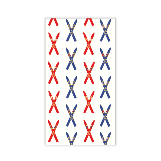 Paper guest napkins imprinted with red and blue skis on a white background
