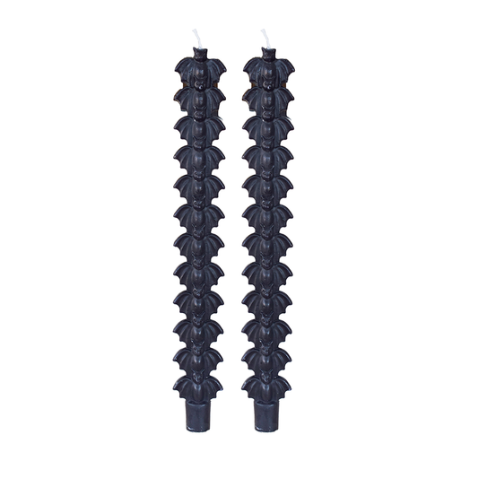 Pair of black decorative candles of bats stacked on one another 