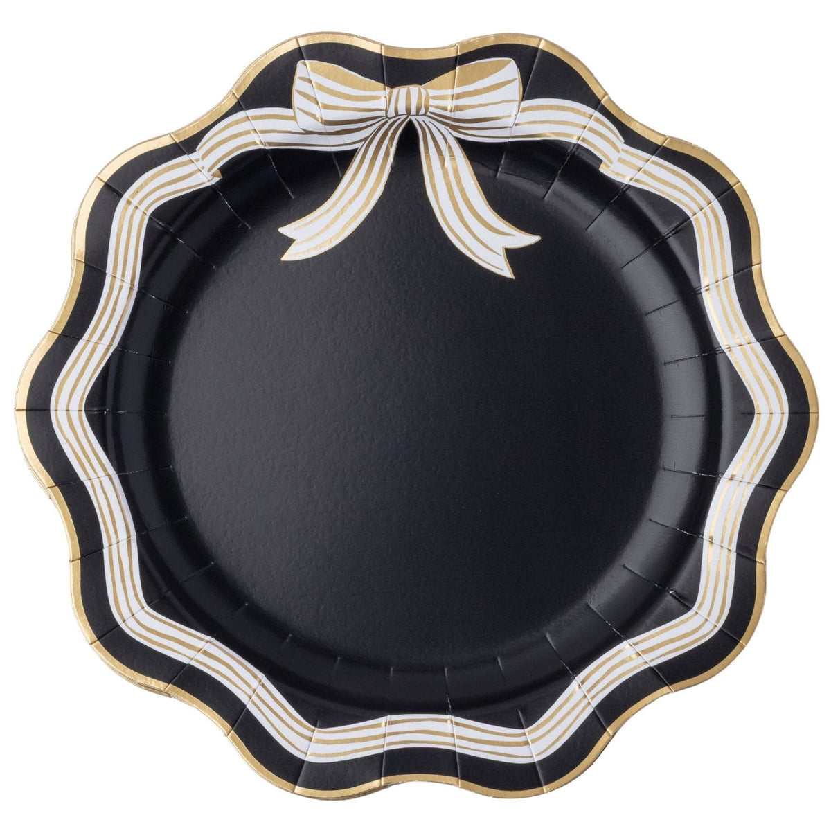 Round black paper party plates with a scalloped edge, featuring a decorative bow design in white and gold stripes along the top border.