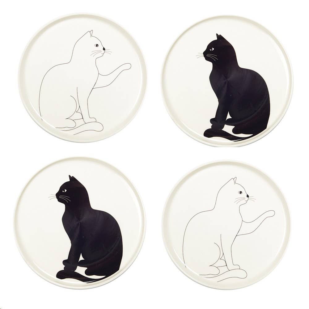 Four plates with black and white cat silhouettes on a white background