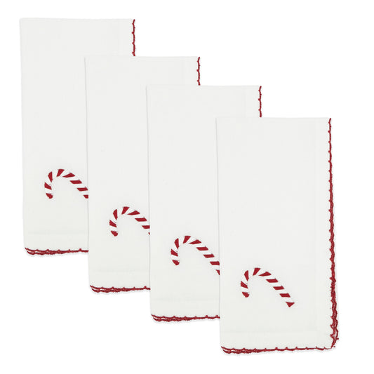 Set of four white napkins with red candy cane designs