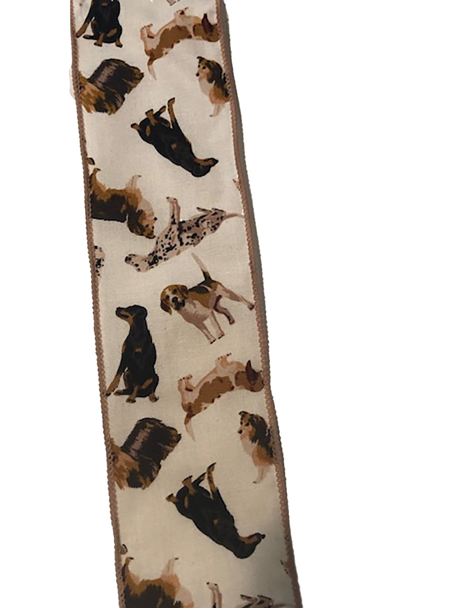 A fabric ribbon  with an allover print of dogs in various poses on a light cream background, finished with a brown border.