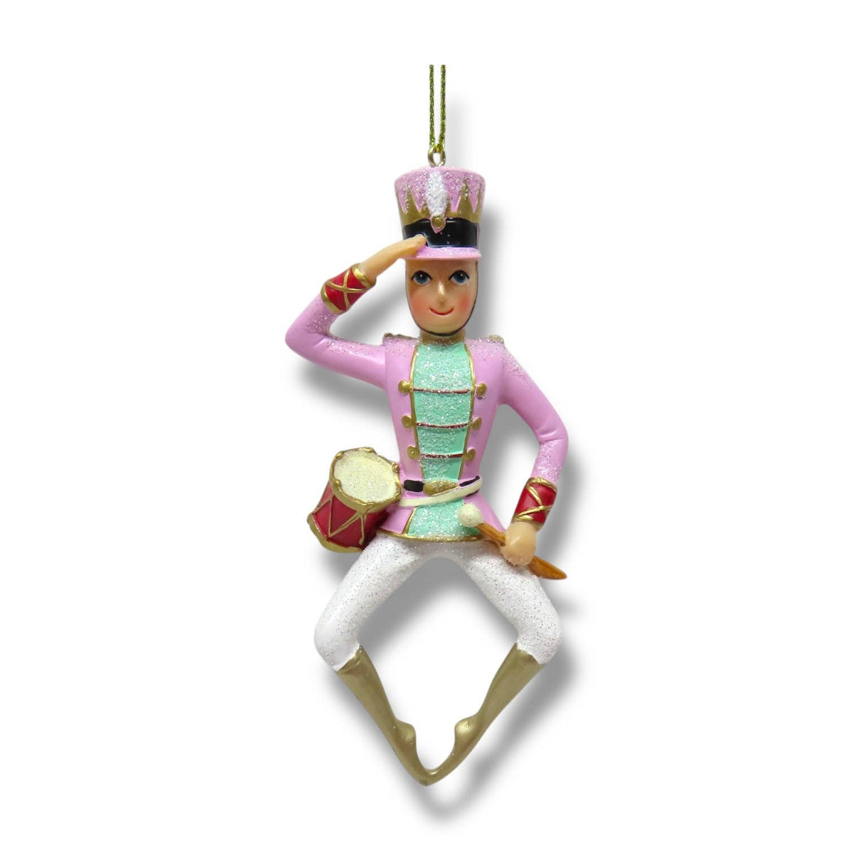 Decorative ornament of a nutcracker drummer in pink uniform with a drum.