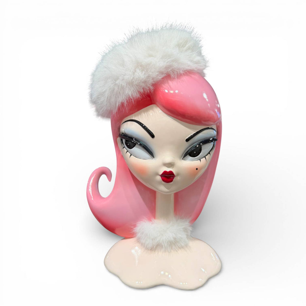 Decorative female bust figurine with pink hair and white fur accents. 