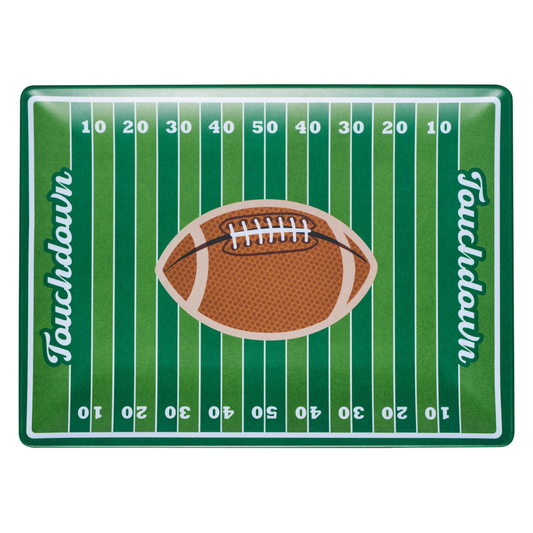 A rectangular melamine platter made to resemble a football field with green and white stripes, white yard numbers, a brown football in the center, and the word 'Touchdown' written vertically on both sides.