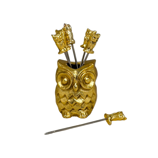 Gold owl-shaped holder with cocktail picks  