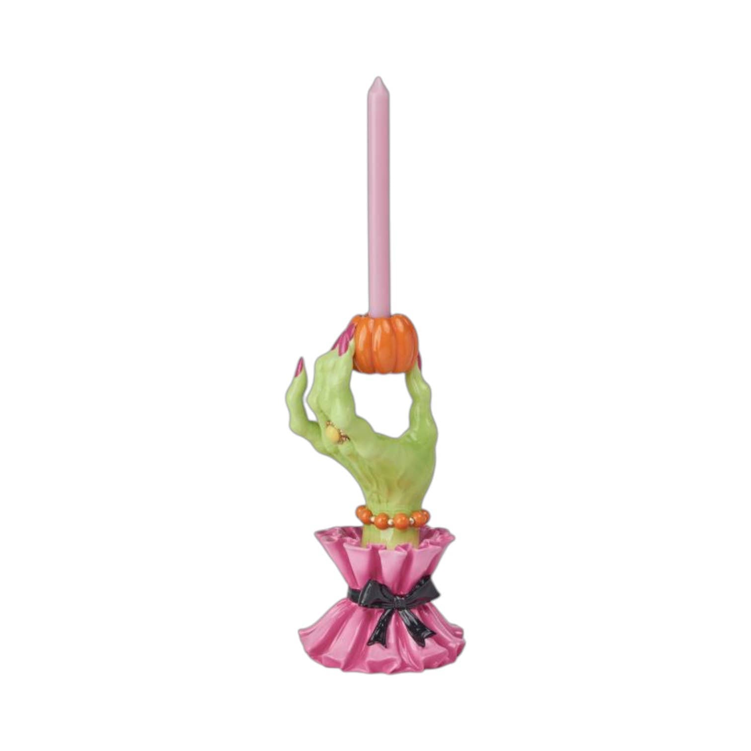 Decorative candle holder shaped like a green witch's hand with pink cuffs. 