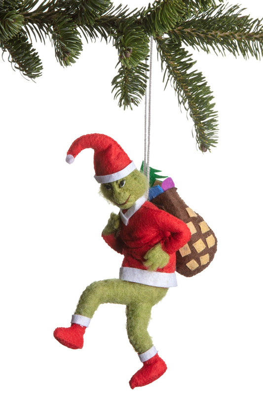 A Grinch-themed Christmas hanging ornament shaped like the Grinch wearing a red Santa outfit and carrying a brown gift sack.