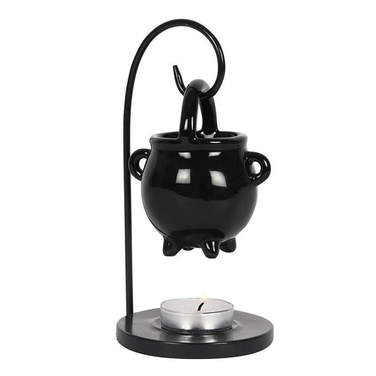 Black cauldron-shaped oil burner with a candle
