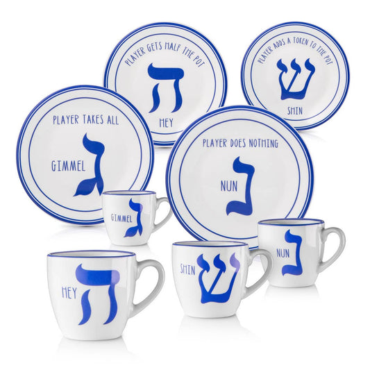 Set of white plates and mugs with blue Hebrew character symbols on a white background