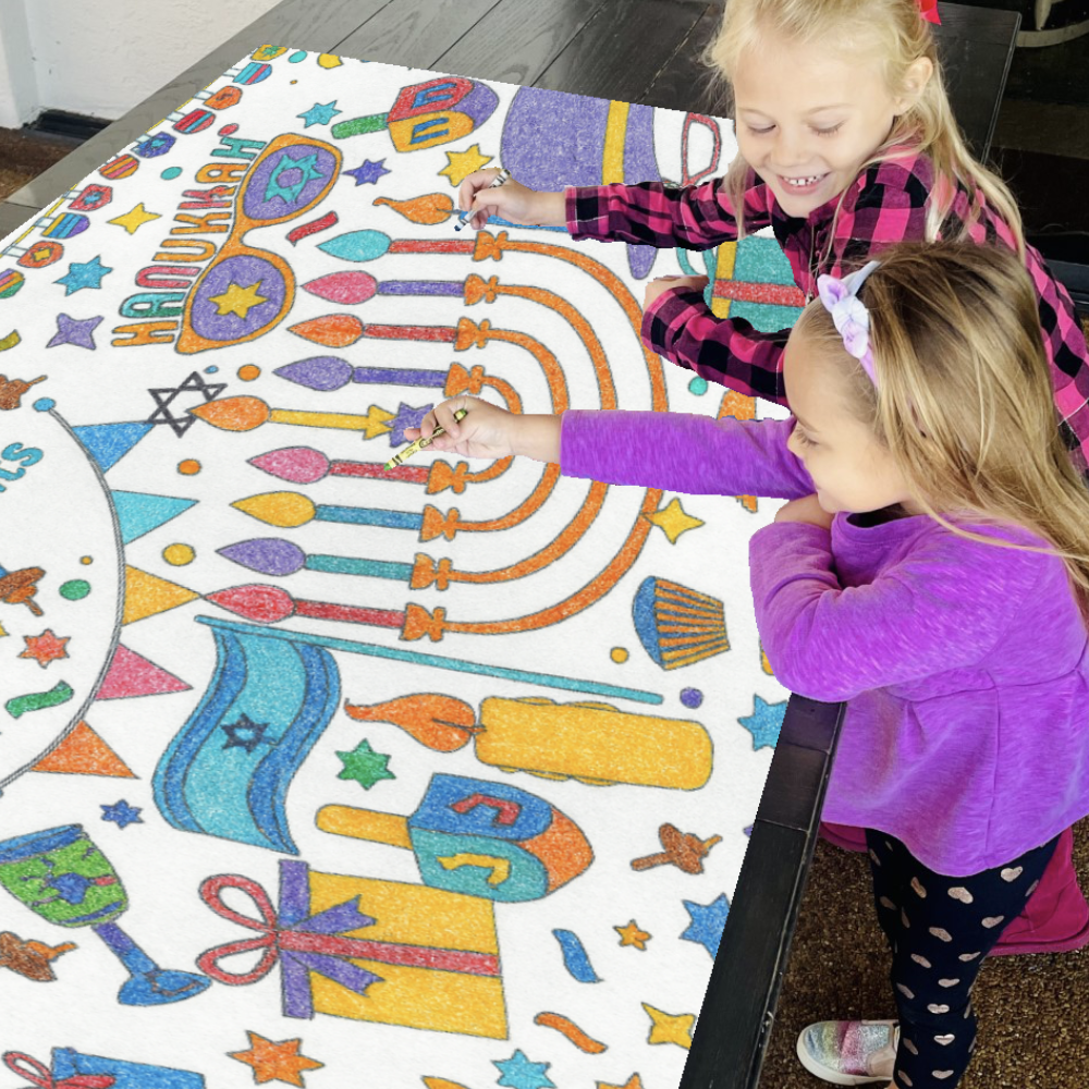 Kids coloring paper tablecloth with a Hanukkah-theme.
