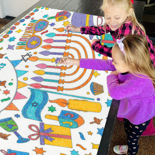 Kids coloring paper tablecloth with a Hanukkah-theme.