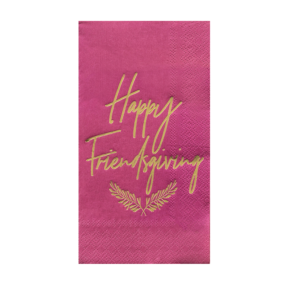 Burgundy paper napkins with 'Happy Friendsgiving' text in gold foil