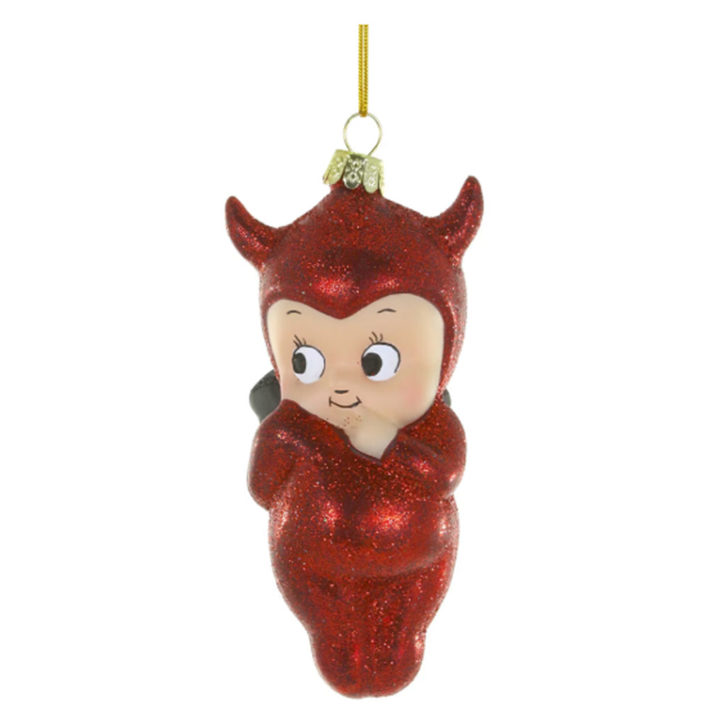 A red glitter Christmas ornament shaped like a baby devil or cherub with small horns, a cream-colored face, and a gold hanging loop at the top.