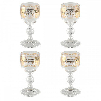 Four decorative miniature glass kiddush cups with gold patterns and the text Kiddush in Hebrew