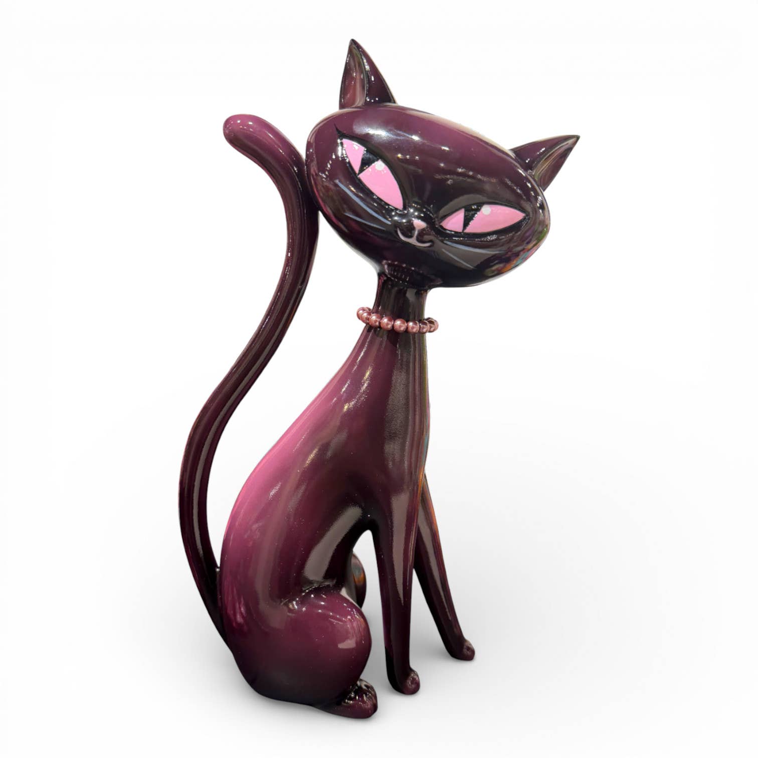 Pink and black cat figurine with pink accents 