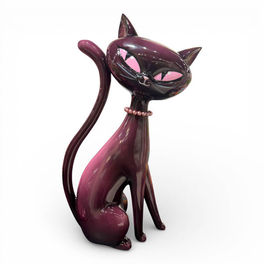 Pink and black cat figurine with pink accents 
