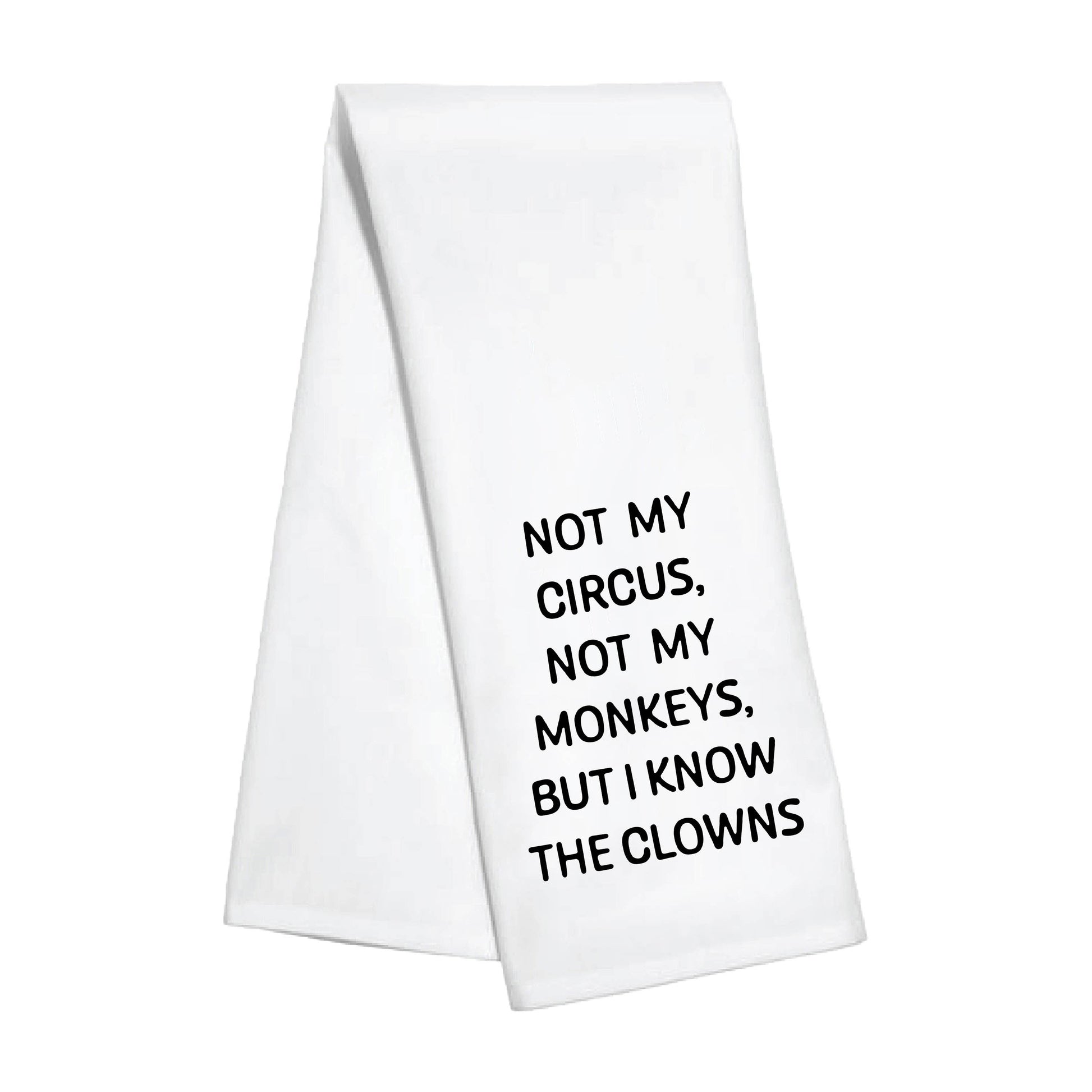 White towel with black text 'Not my circus, not my monkeys, but I know the clowns' 