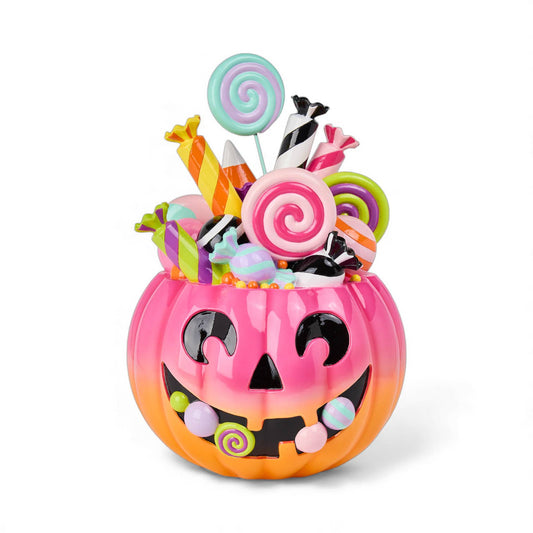 Pink and orange pumpkin Halloween-themed candy container with colorful candies  