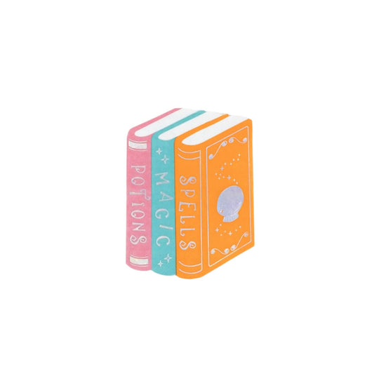 Three colorful paper napkins resemble a stack of books titled 'Potions', 'Magic', and 'Spells' 