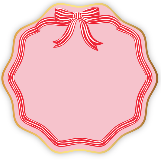 Pink paper dinner plates with a red stripe bow