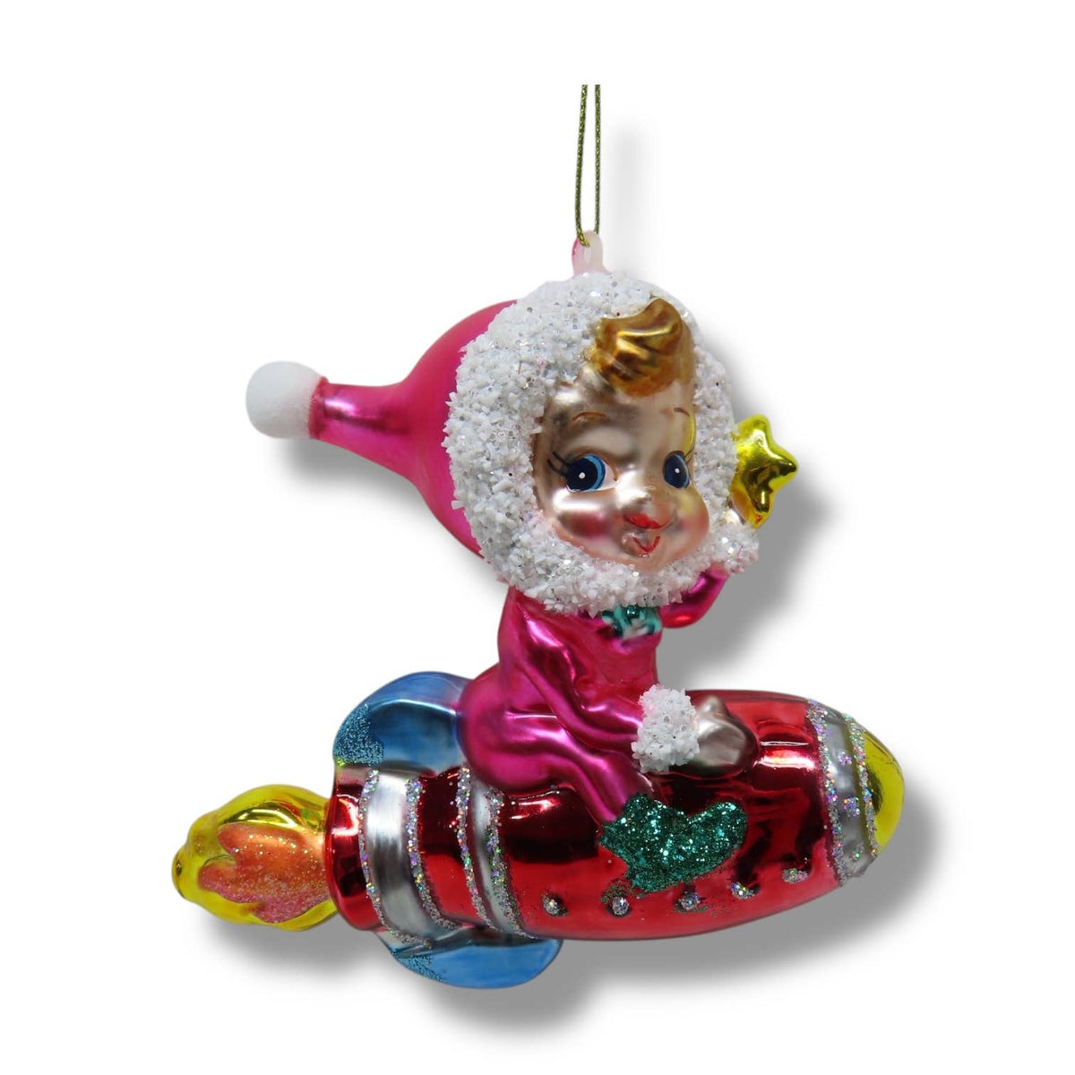 Decorative Christmas ornament of a child riding on rocket.  