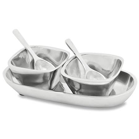 Set of polished aluminum miniature bowls with spoons on a tray