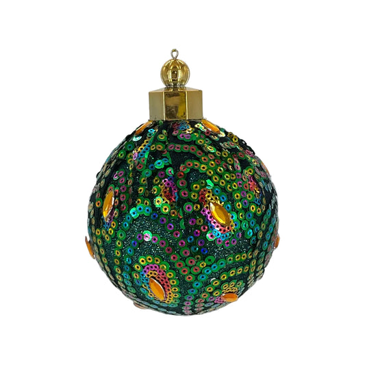 Decorative Christmas ball ornament with peacock pattern created with sequins.