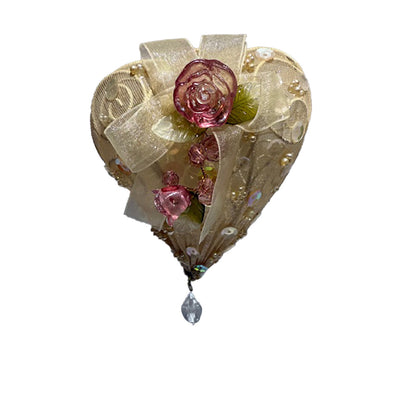 Decorative heart-shaped ornaments with pink roses, gold ribbons  and sequins