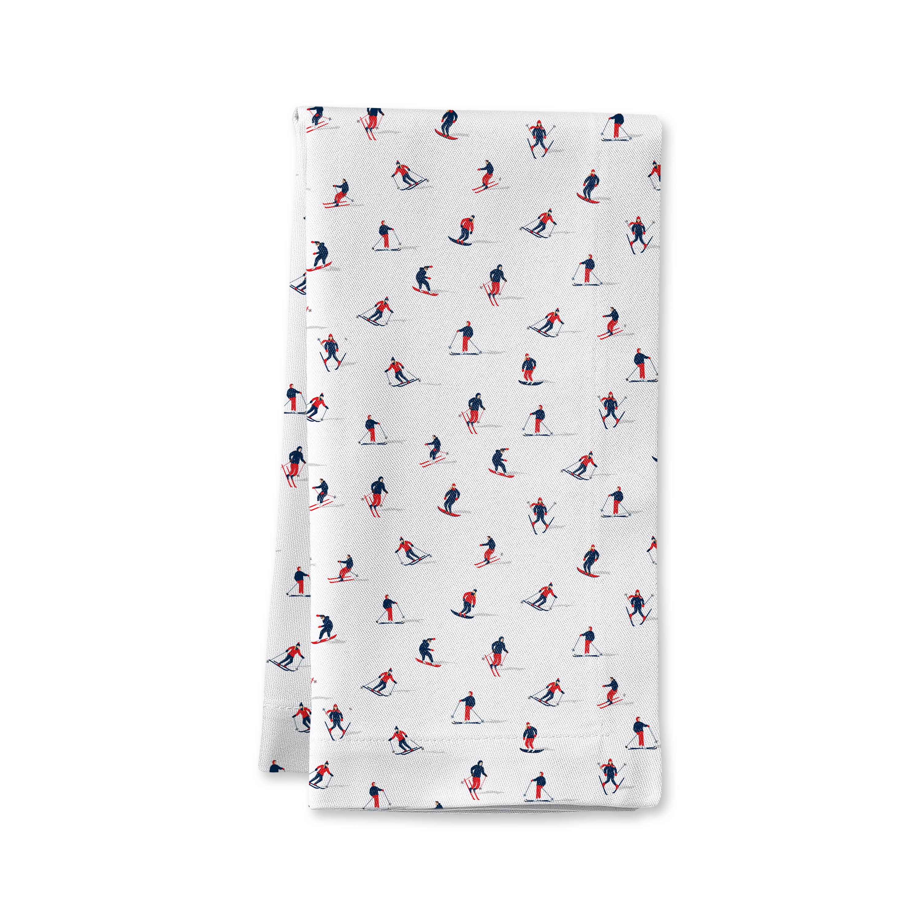 Cloth dinner napkins with a pattern of skiers on a white background