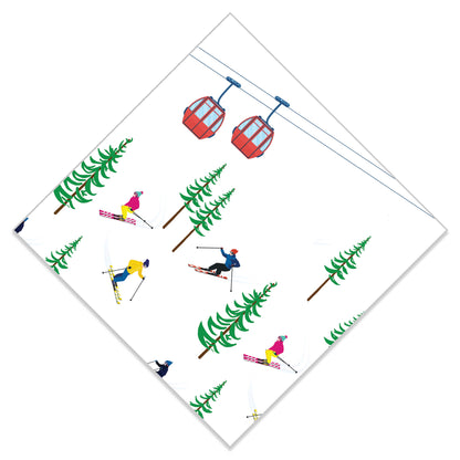 Paper napkins with a pattern of skiers, trees, and a ski lift on a white background