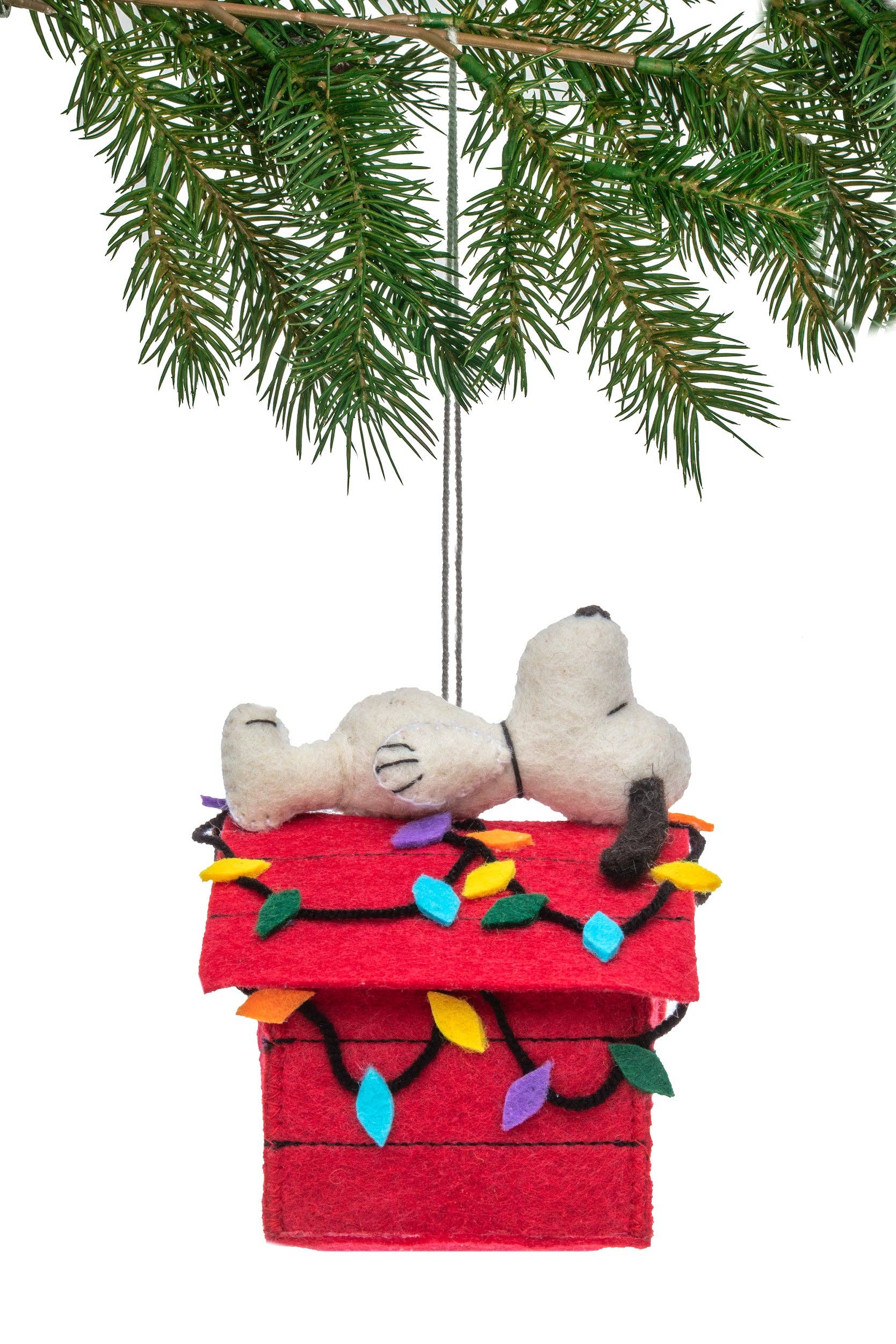 Christmas felt ornament with Snoopy on a red doghouse decorated with lights