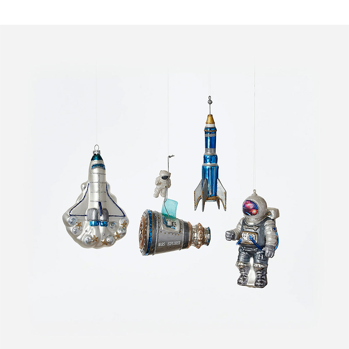 Four hanging space-themed ornaments shaped like a spacecraft, a rocket, and an astronaut.