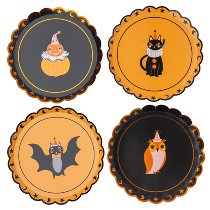  Halloween-themed decorative paper plates. Each plate has a scalloped edge and features a different cute illustration: a pump, a black cat with a white ruff collar, a bat, and an owl wearing a party hat.