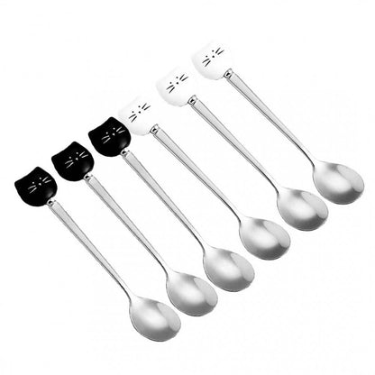 Set of six silver spoons with black  and white cat-shaped handles 